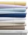 A good night's sleep starts with the pure cotton softness of this Martha Stewart Collection extra deep fitted sheet, featuring a smooth 400 thread count.