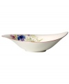 Prolong spring with this lively Mariefleur salad bowl. Splashy colors adorn premium white porcelain edged in red and designed for everyday dining. Mix and match with New Cottage dinnerware, also by Villeroy & Boch.