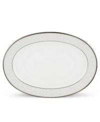 This elegant oval stand is accented with a delicate flourish of vine-like, white-on-white imprints with raised, iridescent enamel dots. 9 long. From Lenox's dinnerware and dishes collection. This elegant oval stand is accented with a delicate flourish of vine-like, white-on-white imprints with raised, iridescent enamel dots. 9 long. From Lenox's dinnerware and dishes collection.