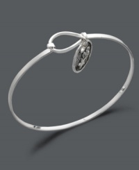 Always aim for the stars. This subtly stylish bangle features an engraved shooting star charm with the words believe in the beauty of your dreams on the flip side. Crafted in sterling silver. Approximate diameter: 2-3/10 inches.