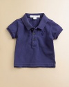 Amazingly soft, this must-have cotton design features an embroidered chest logo.Polo collar Short sleeves Button placket Embroidered chest logo Side slits Cotton Machine wash Imported Please note: Number of buttons may vary depending on size ordered. 