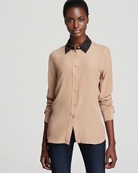 A color-blocked collar adds polish and poise to this silk Equipment blouse for a work-to-weekend look in the season's coolest neutrals. A color-blocked collar adds polish and poise to this silk Equipment blouse for a work-to-weekend look in the season's coolest neutrals.