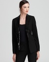 Sequin lapels shimmer against an impeccably tailored MICHAEL Michael Kors jacket, taking the 9-to-5 staple after hours.