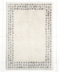 A breath of fresh air. Martha Stewart Collection revives your bathroom in carefree style with this Calendula bath rug, featuring a solid backdrop with a stripe border. Finished in soothing, neutral tones. A breath of fresh air. Martha Stewart Collection revives your bathroom in carefree style with this Calendula bath rug, featuring a solid backdrop with a stripe border. Finished in soothing, neutral tones.