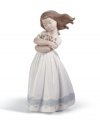 A darling little little girl with flowers, representing innocence, fantasy and curiosity without bounds. Crafted by Lladró, Spain's most esteemed artisans of porcelain figurines.