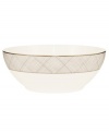 Dressed in a fine diamond grid of bronze and warm taupe, this large round bowl is tailored for formal dining and everyday elegance in bone china. From Noritake's collection of serveware and serving dishes.