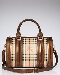 A classic checked motif details this Burberry satchel, offering a rich counterpart to the curvy shape of this versatile handbag. A classic checked motif details this Burberry satchel, offering a rich counterpart to the curvy shape of this versatile handbag.