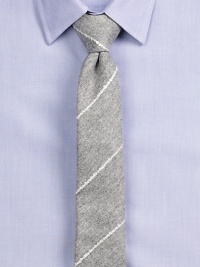 Simple elegance rendered in diagonal striped Italian wool.About 2½ wideWoolDry cleanImported of Italian fabric Simple elegance rendered in diagonal striped Italian wool.About 2½ wideWoolDry cleanImported of Italian fabric