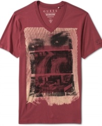 Get graphic with this sleek v-neck printed tee by Guess. Get graphic with this sleek v-neck printed tee by Guess.