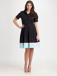 A classic stretch cotton style with a flared skirt featuring a colorblocked hem.Collar styleButton frontCuffed short sleevesAbout 51 from shoulder to hem97% cotton/3% spandexDry cleanMade in USA of imported fabric A classic stretch cotton style with a flared skirt featuring a colorblocked hem.Collar styleButton frontCuffed short sleevesAbout 51 from shoulder to hem97% cotton/3% spandexDry cleanMade in USA of imported fabric