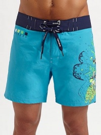 A slightly cropped swim style for every man, brightened with a contemporary floral graphic on the left leg. Lace-up waist Grip-tape back pocket Mesh lining Inseam, about 7 70% cotton/30% polyamide Machine wash Imported A slightly cropped swim style for every man, brightened with a contemporary floral graphic on the left leg. Lace-up waist Grip-tape back pocket Mesh lining Inseam, about 7 70% cotton/30% polyamide Machine wash Imported