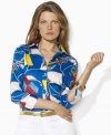 Awash in a vibrant nautical flag print, Lauren by Ralph Lauren's classic tailored shirt is crafted from silky cotton broadcloth with three-quarter sleeves for breezy style.