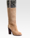 Suede knee-high boot has a contrasting, stacked heel and snake-print leather trim. Stacked heel, 4 (100mm)Shaft, 16Leg circumference, 14Suede and snake-print leather upperPull-on styleLeather liningRubber solePadded insoleImportedOUR FIT MODEL RECOMMENDS ordering one half size up as this style runs small. 