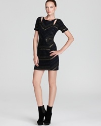 With a deep v back and daring cutouts, Rebecca Minkoff's crystal tweed dress puts a twist on traditional sheaths. With a deep v back and daring cutouts, Rebecca Minkoff's crystal tweed dress puts a twist on traditional sheaths.
