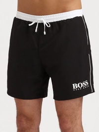 These handsome solid swim trunks sport a drawstring waistband and the classic BOSS logo.Elastic drawstring waistbandSide slash pocketsMesh liningInseam, about 6PolyamideMachine washImported