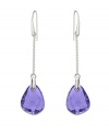 Pretty in purple: Striking tanzanite-colored stones adorn Swarovski's linear drop crystal earrings. They're an eye-catching element to enhance any outfit. Crafted in silver tone mixed metal. Approximate drop: 3-1/8 inches.