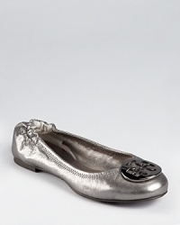 Tory Burch's iconic Reva ballet is updated for the season in metallic pewter leather and polished gunmetal hardware. Tory Burch's iconic Reva ballet is updated for the season in metallic pewter leather and polished gunmetal hardware.