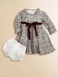 Blooming with a vivid floral print and a velvet tie, this delightful cotton frock with matching bloomers will make your little one feel like a flower girl.Ruffled round necklineLong sleevesBack buttonsWaistband with velvet ribbon tieFull skirtFully linedCottonMachine washImported Please note: Number of buttons may vary depending on size ordered. Blooming with a vivid floral print and a velvet tie, this delightful cotton frock with matching bloomers will make your little one feel like a flower girl.Ruffled round necklineLong sleevesBack buttonsWaistband with velvet ribbon tieFull skirtFully linedCottonMachine washImported Please note: Number of buttons may vary depending on size ordered.