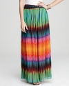 Enlivened by a vivid tie-dye print, this VINCE CAMUTO maxi skirt infuses your look with a rush of bohemian spirit.
