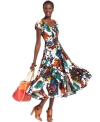 Covered in a bold pattern of tropical blossoms, a cap-sleeved Grace Elements dress peasant dress effortlessly embodies summer-ready style. Its swingy skirt creates soft movement while bright accessories make the look pop. Covered in a bold pattern of tropical blossoms, a cap-sleeved Grace Elements dress peasant dress effortlessly embodies summer-ready style. Its swingy skirt creates soft movement while bright accessories make the look pop.