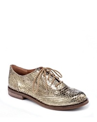 Must-have oxford flats are golden in snakeskin-embossed metallic leather that takes the look from library to Las Vegas, by Lucky Brand. Must-have oxford flats are golden in snakeskin-embossed metallic leather that takes the look from library to Las Vegas, by Lucky Brand.