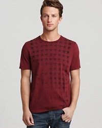 Rendered in plush cotton for softness, this tee pairs well with jeans and shorts alike for a casual, laid-back look. Rendered in plush cotton for softness, this tee pairs well with jeans and shorts alike for a casual, laid-back look.