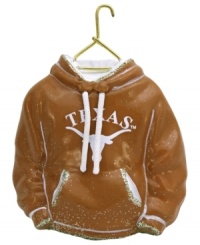 Fitting for Texas alum, this hand-painted hoodie ornament trims the tree in classic Longhorns colors. Glitter amps up the school and holiday spirit. Fitting for Texas alum, this hand-painted hoodie ornament trims the tree in classic Longhorns colors. Glitter amps up the school and holiday spirit.