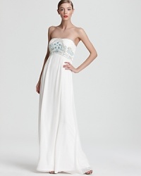 This floor-sweeping SW Studio by Sue Wong strapless gown is crowned by a brightly beaded bodice for ethereal glamour. This floor-sweeping SW Studio by Sue Wong strapless gown is crowned by a brightly beaded bodice for ethereal glamour.