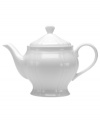 The perfect size for afternoon tea or small gatherings, this gracefully shaped teapot from Mikasa's Antique White dinnerware and dishes collection has a soft fluid feel and clean, embossed design.