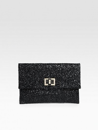 A cocktail essential covered in glittery fabric with a turnlock clasp and rich leather lining.Turnlock closure One inside open pocket Leather lining 9W X 6¼H X ½D Imported A cocktail essential covered in glittery fabric with a turnlock clasp and rich leather lining.Turnlock closure One inside open pocket Leather lining 9W X 6¼H X ½D Imported