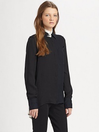 Make a fashion-forward impression with this lengthy silk blouse, defined by contrast trim and a split shirttail hem. Contrasting stand collarLong sleeves with buttoned cuffsButton frontSingle front patch pocketShirttail hem with back slitSilkDry cleanImportedModel shown is 5'7 (174cm) wearing US size 2. Make a fashion-forward impression with this lengthy silk blouse, defined by contrast trim and a split shirttail hem. Contrasting stand collarLong sleeves with buttoned cuffsButton frontSingle front patch pocketShirttail hem with back slitSilkDry cleanImportedModel shown is 5'7 (174cm) wearing US size 2.