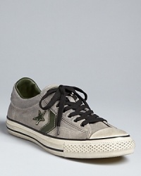 A distressed low-top sneaker that's vintage-inspired and qualitatively cool. From Converse by John Varvatos. A distressed low-top sneaker that's vintage-inspired and qualitatively cool. From Converse by John Varvatos.