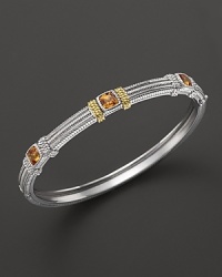 Detailed in 18K yellow gold, Judith Ripka's sterling silver and honey corundum bangle lends a timelessly luxe look. Detailed in 18K yellow gold, Judith Ripka's sterling silver and honey corundum bangle lends a timelessly luxe look.