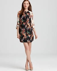 A lush floral print adorns this tunic-style 10 Crosby Derek Lam silk dress. Contrast sleeves add modern pop. A lush floral print adorns this tunic-style 10 Crosby Derek Lam silk dress. Contrast sleeves add modern pop.
