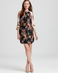 A lush floral print adorns this tunic-style 10 Crosby Derek Lam silk dress. Contrast sleeves add modern pop.