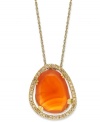 A splash of citrus spices up any look. Crafted in 14k gold over sterling silver, this asymmetrical carnelian stone (6-1/2 ct. t.w.) pops against a sparkling diamond frame (1/5 ct. t.w.). Approximate length: 18 inches. Approximate drop: 3/4 inch.