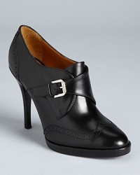 Wingtip detailing lends a menswear look to Ralph Lauren Collection's Nanine booties; a monkstrap inspired vamp seals the trend-right deal. Wingtip detailing lends a menswear look to Ralph Lauren Collection's Nanine booties; a monkstrap inspired vamp seals the trend-right deal.
