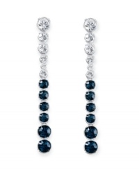 Revel in utter elegance. Swarovski's Hot Montana drop earrings feature icy round-cut clear and Montana blue crystals in a silver tone mixed metal setting. Approximate drop: 3 inches. Revel in utter elegance. Swarovski's Hot Montana drop earrings feature icy round-cut clear and Montana blue crystals in a silver tone mixed metal setting. Approximate drop: 3 inches.