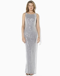 Capturing timeless elegance in a sweeping floor-length silhouette, the evening gown is tailored with a sequined mesh overlay and a sexy cowled back for an alluring finish. Capturing timeless elegance in a sweeping floor-length silhouette, the evening gown is tailored with a sequined mesh overlay and a sexy cowled back for an alluring finish.