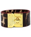 Fashion in a flash! Jessica Simpson's chic turnlock bracelet features leopard printed leather and gold tone mixed metal. Approximate length: 8 inches.