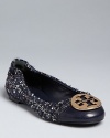 Tory Burch takes one of your favorite ballet flats into cooler weather in stylish tweed, polished off with leather cap toes and signature logo hardware.