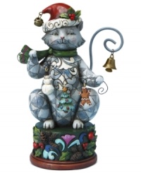 With bells on. Clawing her way to the top of your tree, Jim Shore's Christmas cat carries a few ornaments of her own – a snowman, tree and gingerbread man – and sits up on a pedestal of holly and pine cones. With bells on. Clawing her way to the top of your tree, Jim Shore's Christmas cat carries a few ornaments of her own – a snowman, tree and gingerbread man – and sits up on a pedestal of holly and pine cones.