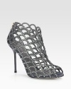 Light-catching Swarovski crystals adorn this modern cage silhouette rendered in soft Italian suede. Self-covered heel, 4¼ (110mm)Swarovski crystal-coated suede upperPeep toeBack zipLeather lining and solePadded insoleMade in Italy