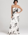 Sequin-adorned lace appliqués sparkle on this Carmen Marc Valvo strapless gown, emboldened by an abstract floral print.