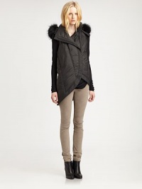 From the HELMUT capsule collection. Classic puffer vest has a raccoon fur-trimmed hood and contemporary, asymmetrical hem. Attached hood with dyed raccoon fur trimSleevelessAsymmetrical front zipperSlash pocketsAsymmetrical hi-lo hemAbout 25 from shoulder to hemPolyamideDry cleanImported of Italian fabricFur origin: FinlandModel shown is 5'10 (177cm) wearing US size Small. From the HELMUT capsule collection. Classic puffer vest has a raccoon fur-trimmed hood and contemporary, asymmetrical hem. Attached hood with dyed raccoon fur trimSleevelessAsymmetrical front zipperSlash pocketsAsymmetrical hi-lo hemAbout 25 from shoulder to hemPolyamideDry cleanImported of Italian fabricFur origin: FinlandModel shown is 5'10 (177cm) wearing US size Small.