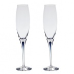 Orrefors Intermezzo Blue Collection designed by Erika Lagerbielke. From the name synonymous with unique and luxurious art glass, Orrefors' Intermezzo Blue has a distinct teardrop of blue in the stem.