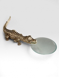 A gleaming goldplated brass croc grips a smooth-edged magnifying glass. 7.5 long Imported A gleaming goldplated brass croc grips a smooth-edged magnifying glass. 7.5 long Imported