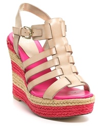 Hot pink stripes race around the wedge heel of Aqua's Delhi espadrille, paired with a caged vamp in neutral nude leather. Hot pink stripes race around the wedge heel of Aqua's Delhi espadrille, paired with a caged vamp in neutral nude leather.