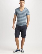 Contrasting stripes and an unfinished hem add some cool style to this comfortable v-neck design. V-neckShort sleevesUnfinished hemlineAbout 28 from shoulder to hem61% polyester/24% cotton/15% linenMachine washImported