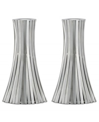Always shining, the Silver Vertical Bound candlestick from Donna Karan Lenox is wrapped in long metal channels that overlap to create a simple cone shape. Always shining, the Silver Vertical Bound candlestick from Donna Karan Lenox is wrapped in long metal channels that overlap to create a simple cone shape.